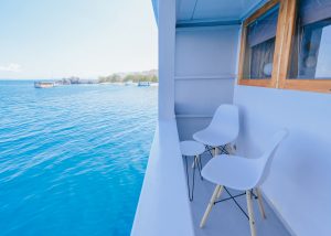 Private Komodo island trip experience on a phinisi boat balcony