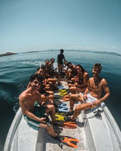Group of travelers on a boat getting ready to snorkel during a Komodo island trip